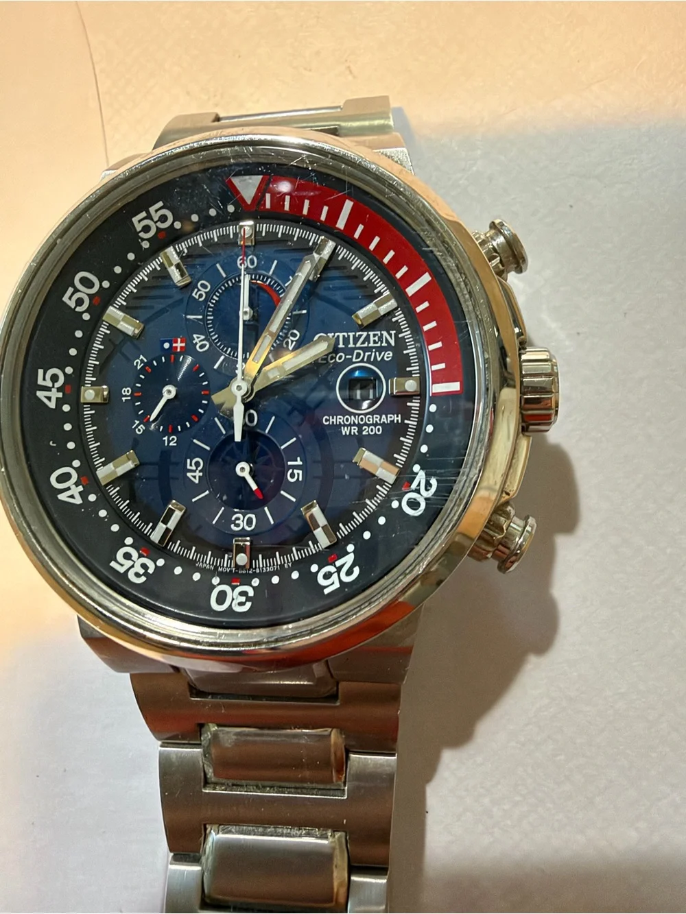 Citizen Blue Dial Chronograph Watch with Red Bezel Accent